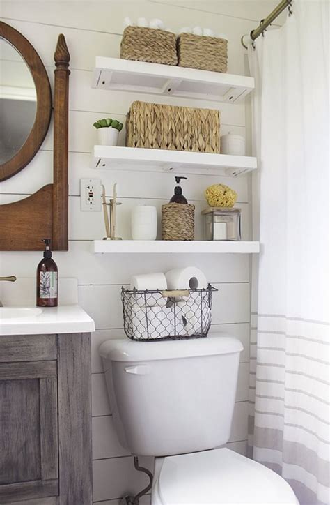 Above toilet storage ideas - Eleanor 34.1" W x 38.3" H Over the Toilet Storage. This over-the-toilet storage perfectly fits in small bathrooms and powder rooms. This free-standing unit adds extra storage to tight spaces with its 9 adjustable shelves. Conceal your toiletries and products with the side cabinet doors for a clutter-free and neat look. 